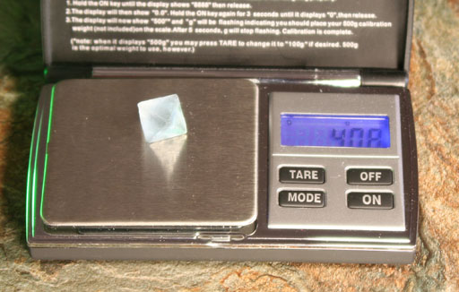 Weighing diamond shaped mineral