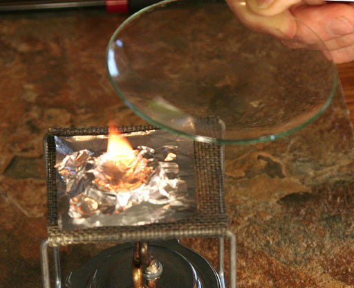 Watch glass ready to smother fire