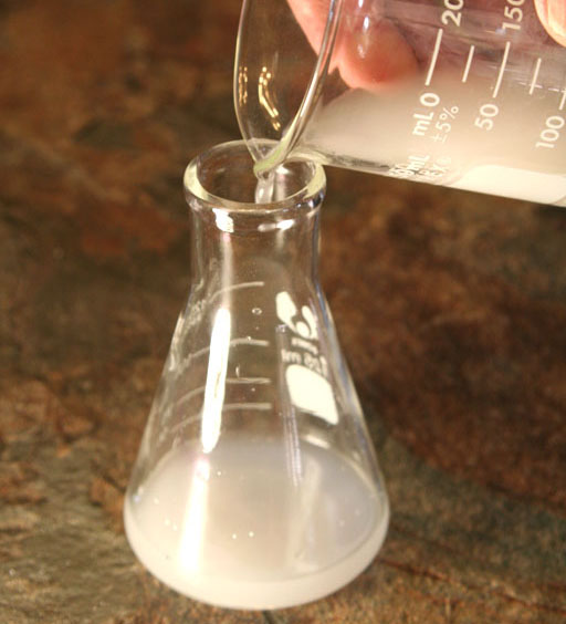 Pour water from mixture into flask