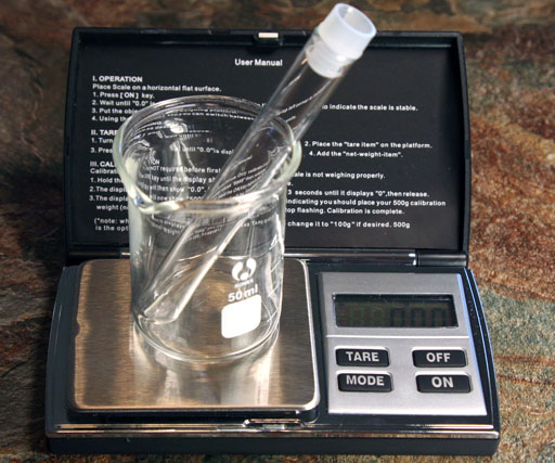 mass of beaker and empty test tube set to zero